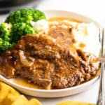 Steak smothered in gravy wish mashed potatoes.