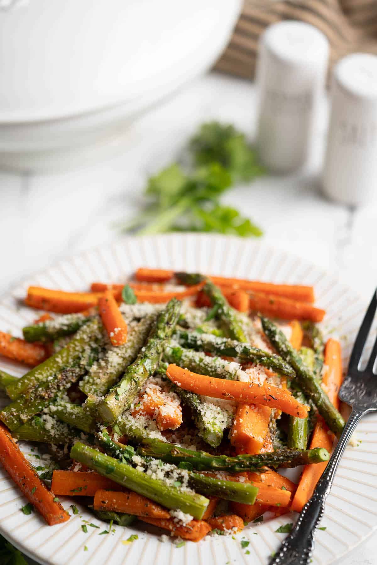 Roasted Carrots and asparagus on a serving tray.