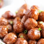 A platter of grape jelly barbecue meatballs.