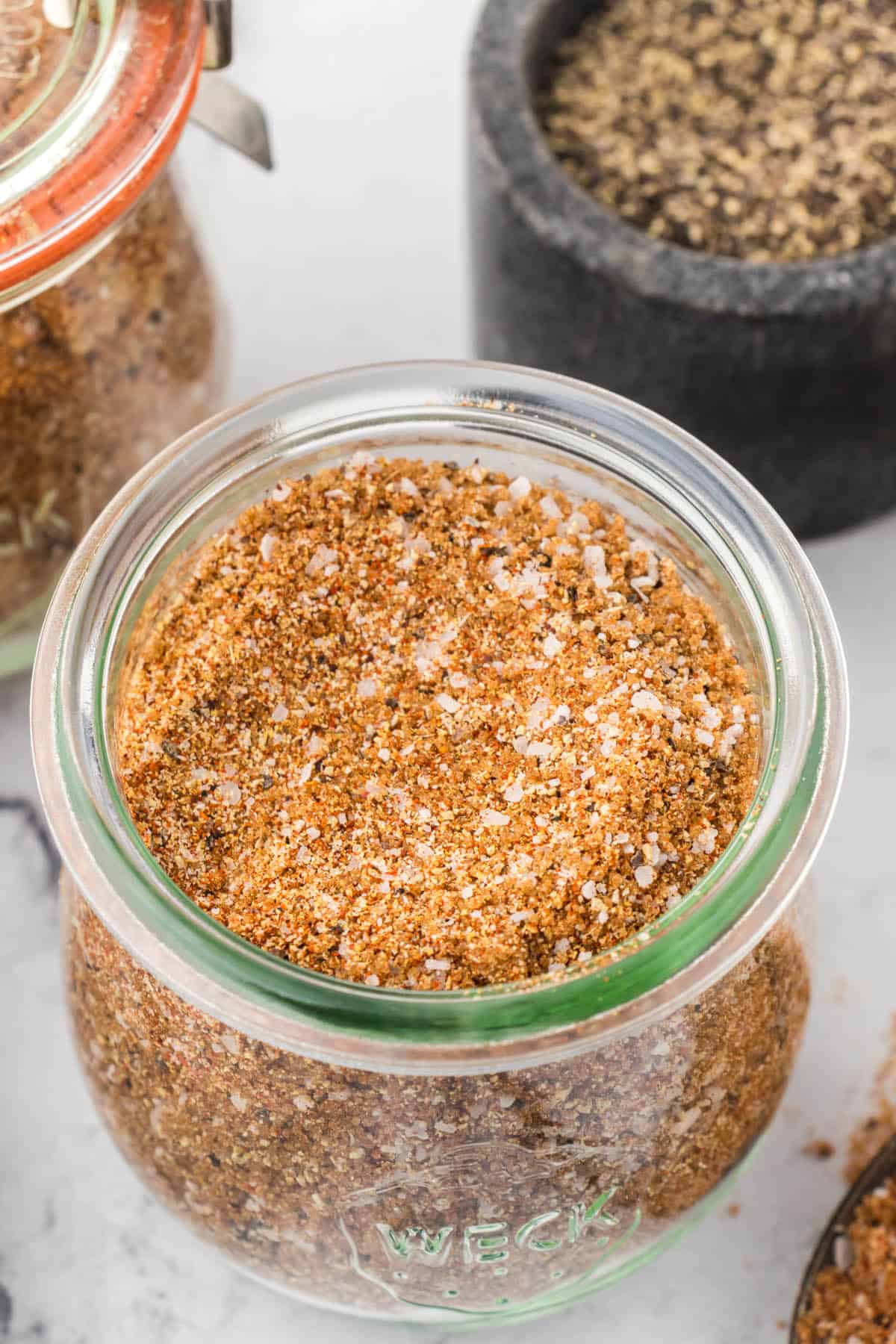 Sweet rib rub recipe in a small jar.