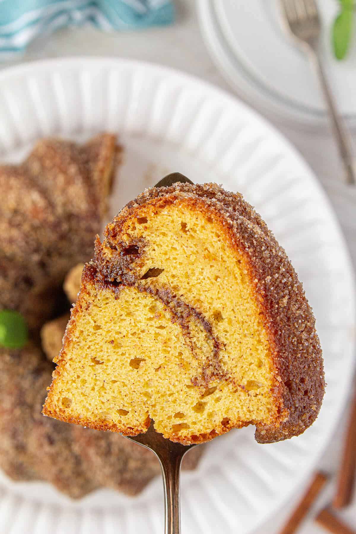 A slice of Churro Bundt Cake on a cake knife.