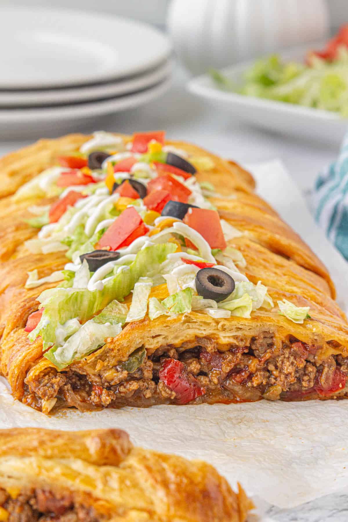 Baked Fajita Taco Braid sliced open, laying on parchment paper.