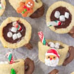 Hot chocolate cookie cups on a baking sheet.