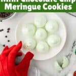 Meringue Cookies on a plate. A hand is reaching in with a red glove on to grab a cookie. With print overlay for Pinterest.