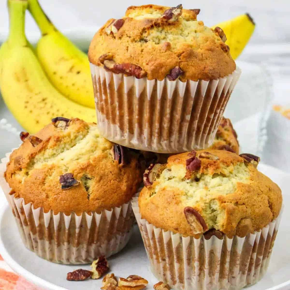 Three Banana Nut muffins on a platter. 