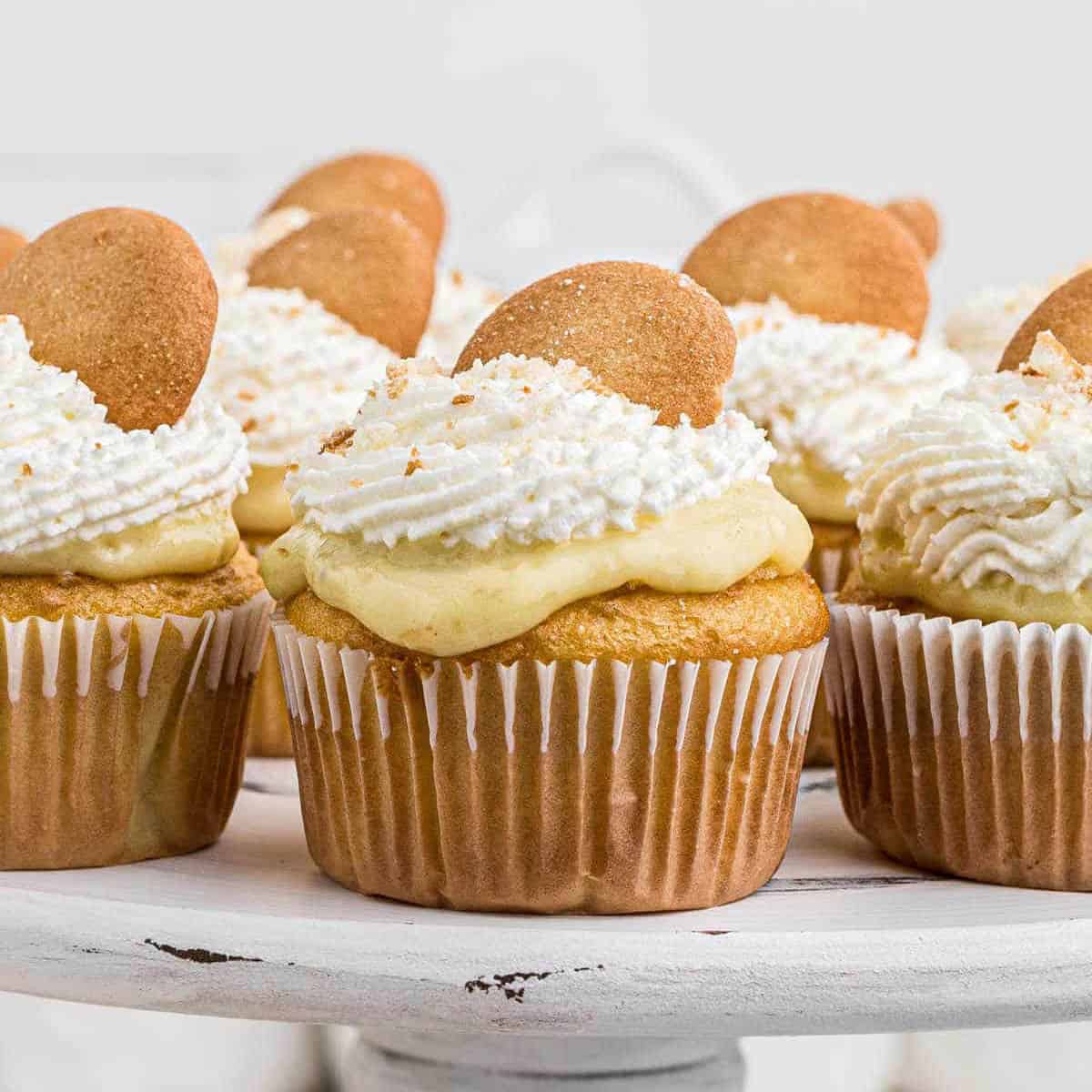 Banana Pudding Cupcakes on a cake stand.