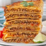 A stack of Ground Beef Quesadillas on a plate.