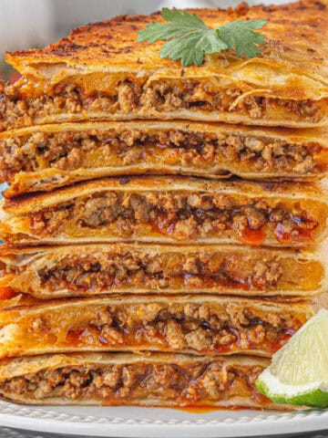 A stack of Ground Beef Quesadillas on a plate.