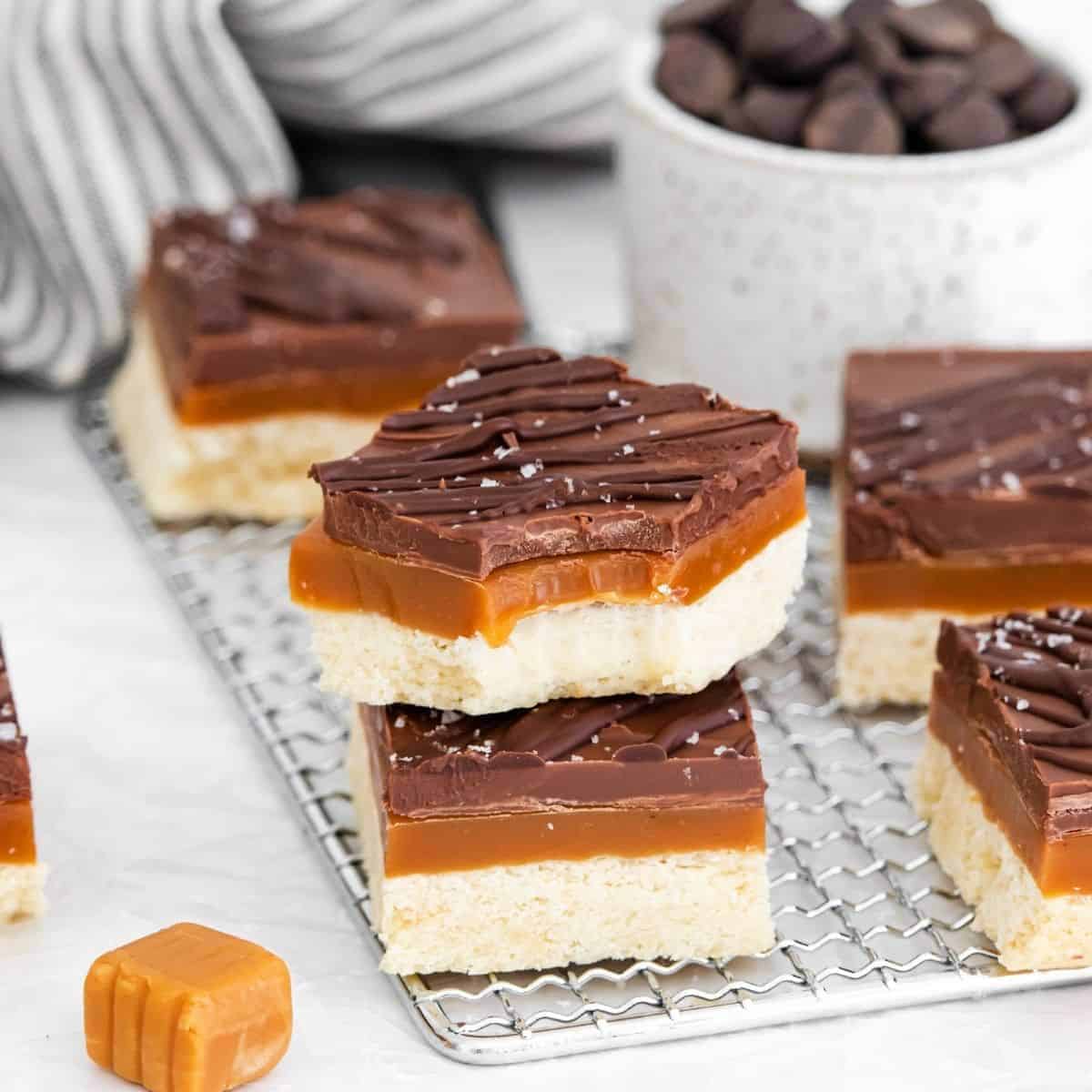 Homemade Twix Bars sliced on a cooling rack. 