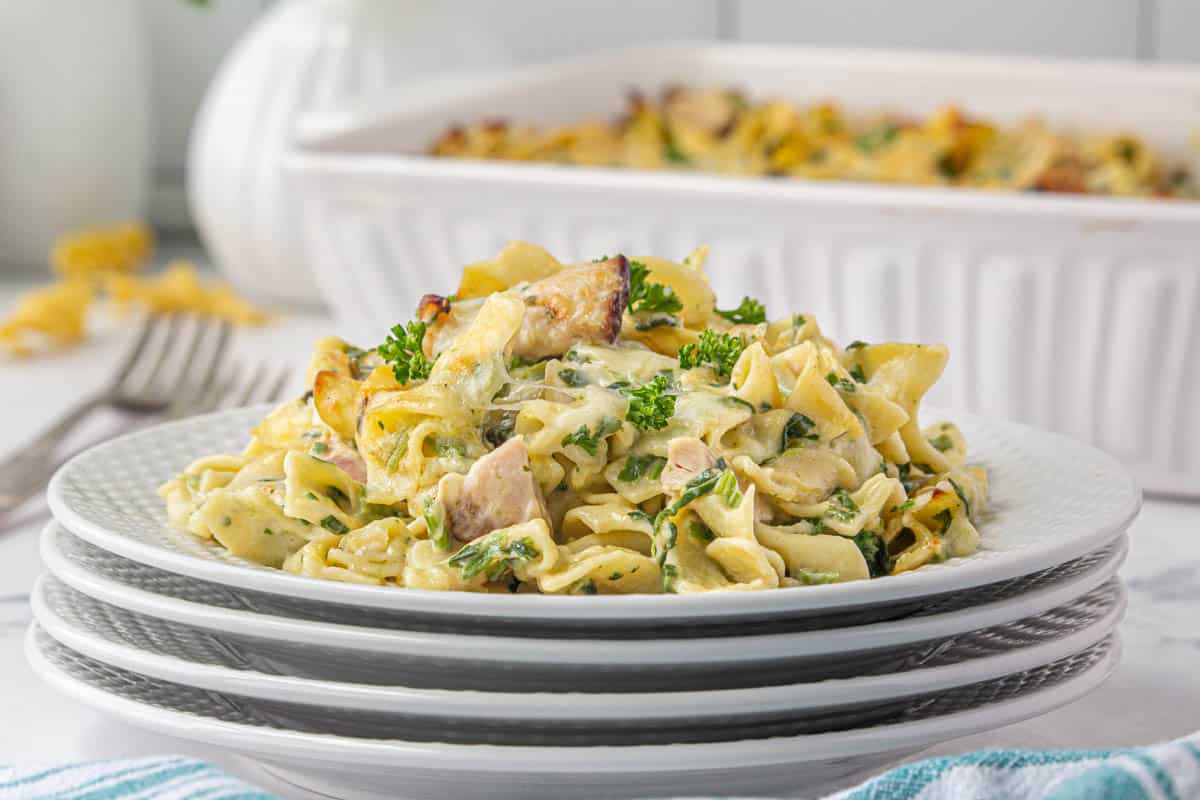 Smoke turkey pasta bake on plate with the rest of the casserole in the background.