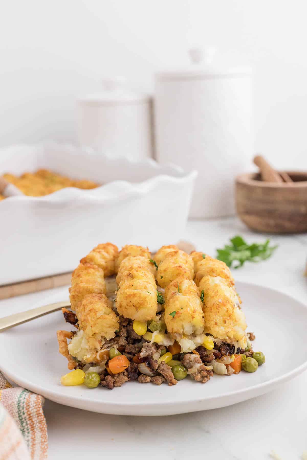 Ground Beef Tater Tot bake on a plate with a fork.