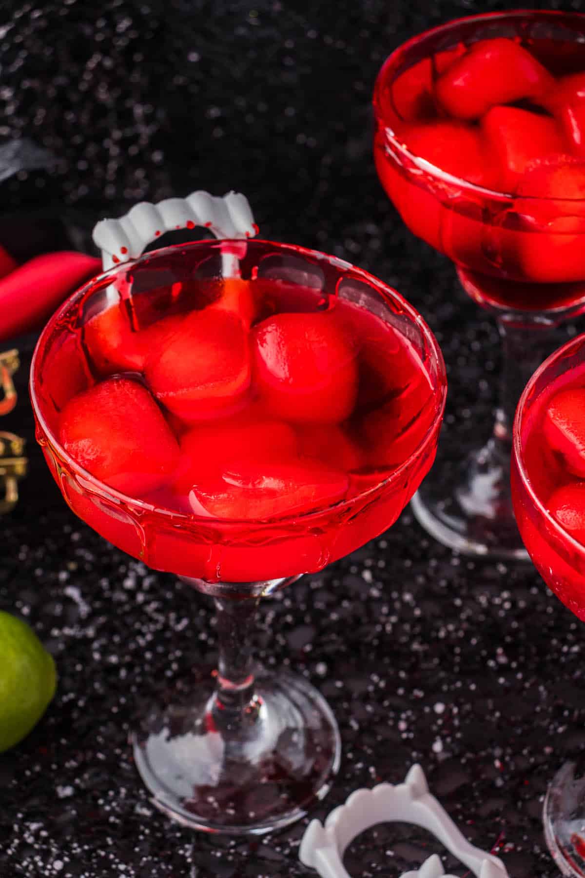 Spooky Vampire Margaritas garnished with vampire teeth.