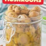 A jar filled with pickled mushrooms. With print overlay for Pinterest.
