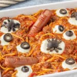 A casserole dish filled with spooky Halloween pasta.