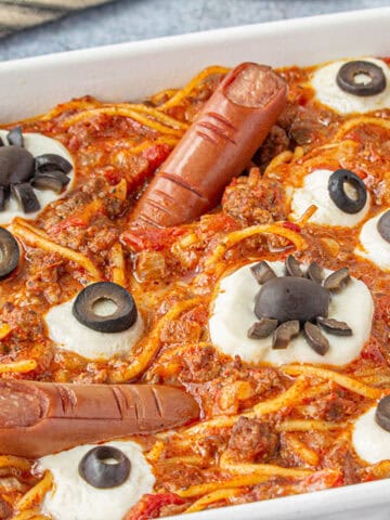 A casserole dish filled with spooky Halloween pasta.