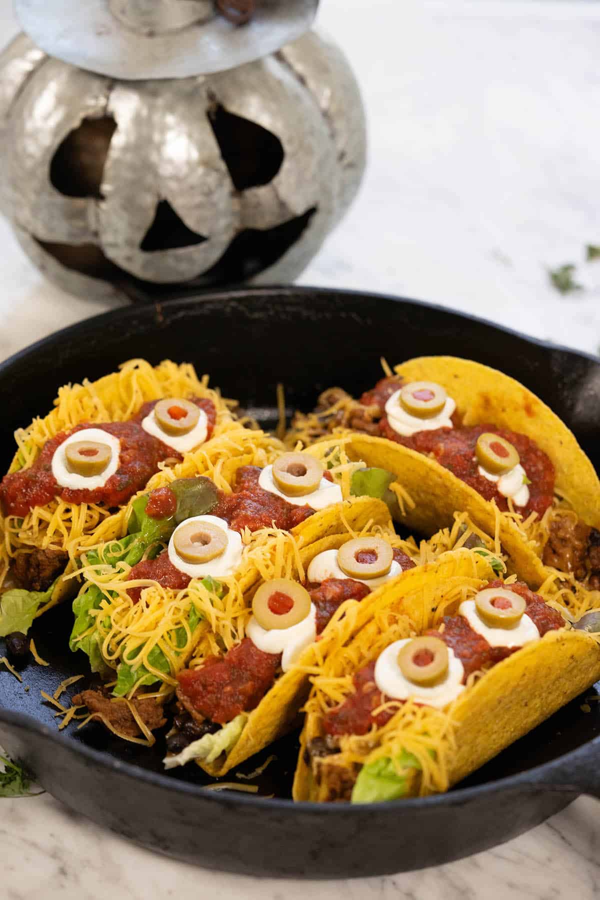 Tacos in a skillet decorated for Halloween.