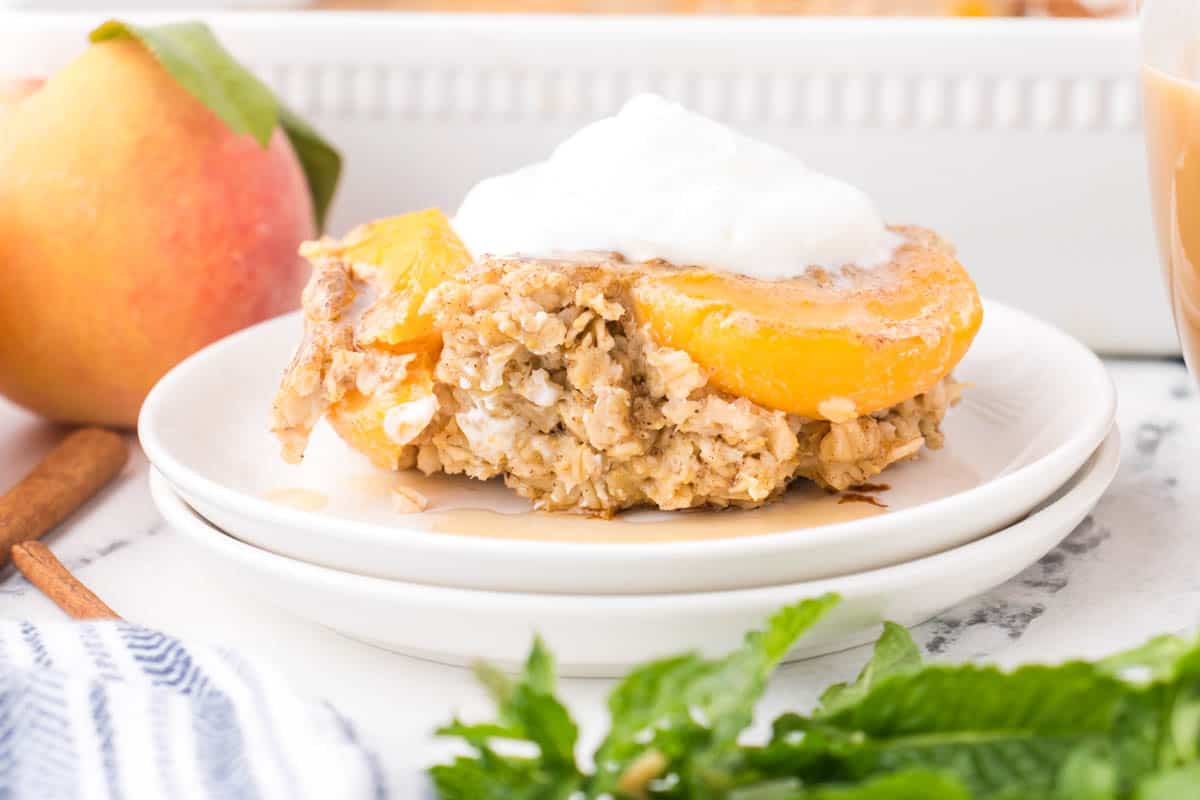 Oatmeal breakfast bake with peaches on a plate.