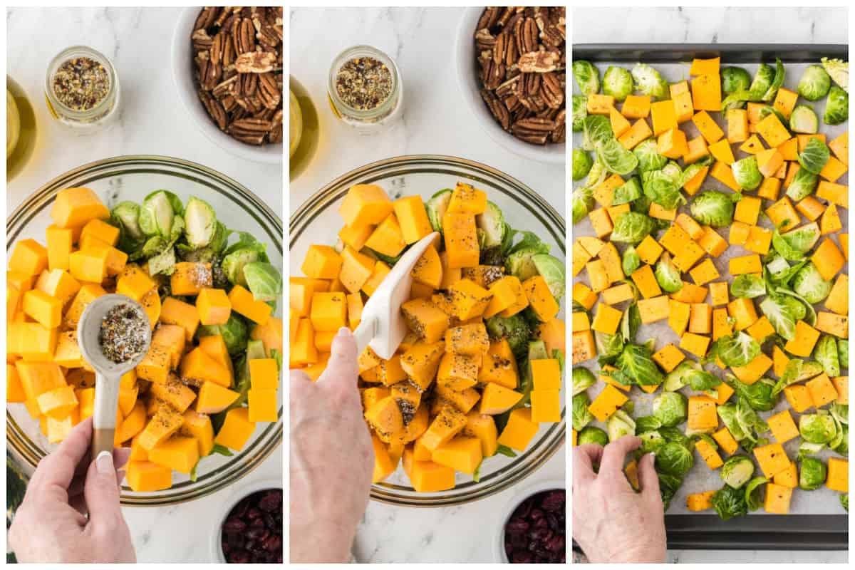 Chopped vegetables being seasoned before being spread on a baking sheet.