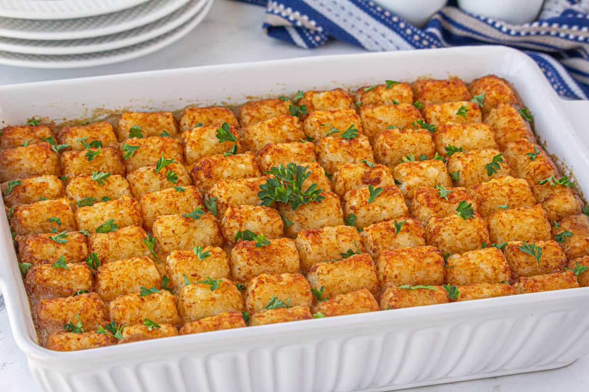 A baked tater tot shepherd's pie casserole in a baking dish.