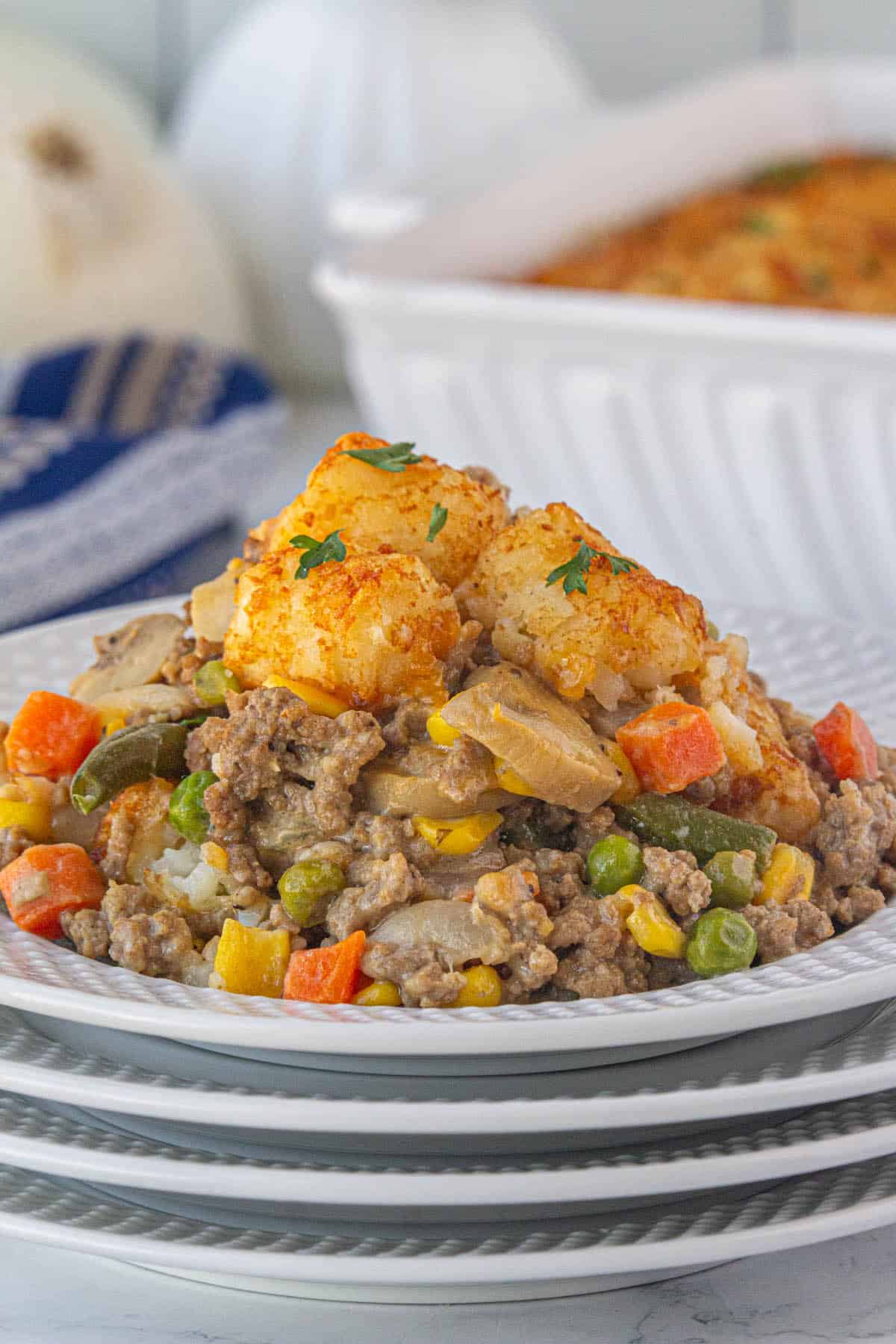 Tater tot shepherds pie casserole on a plate ready to eat.