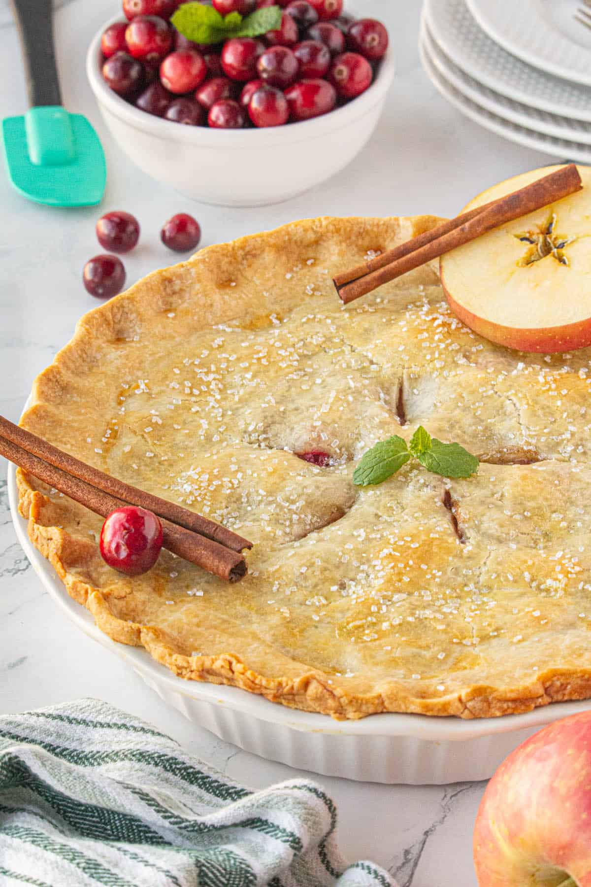 A baked cranberry apple pie.