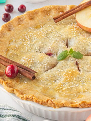 A freshly baked apple cranberry pie.