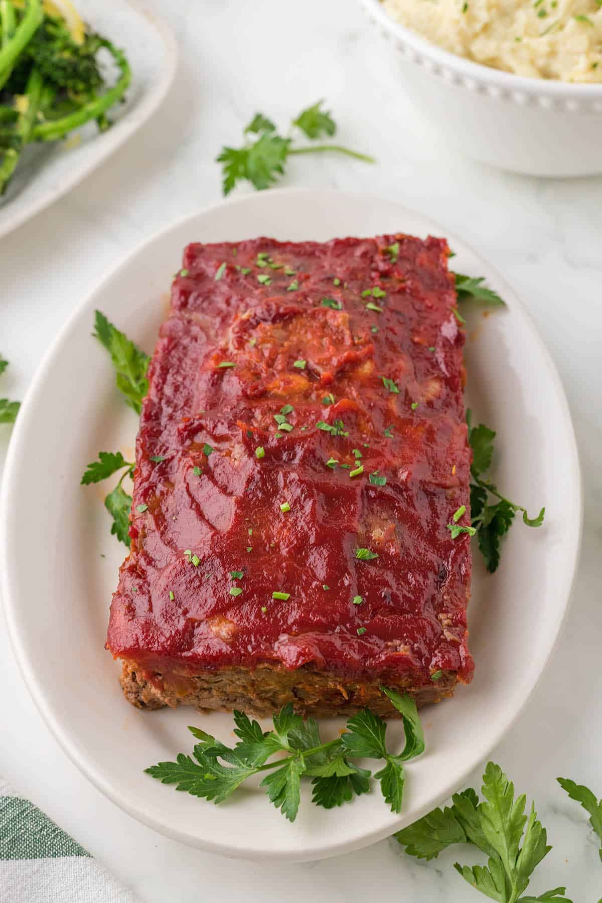 Copycat Cracker Barrel Meatloaf Recipe that has been cooked and on a large platter.