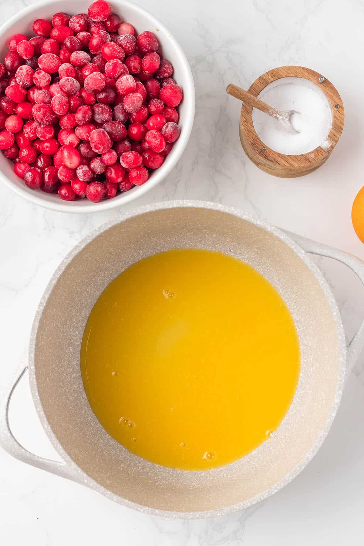 Orange juice in a saucepan.