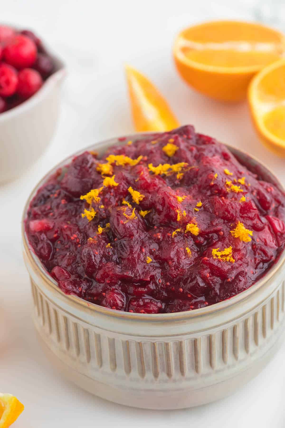 Cranberry sauce in a bowl, ready to be served for a holiday dinner.