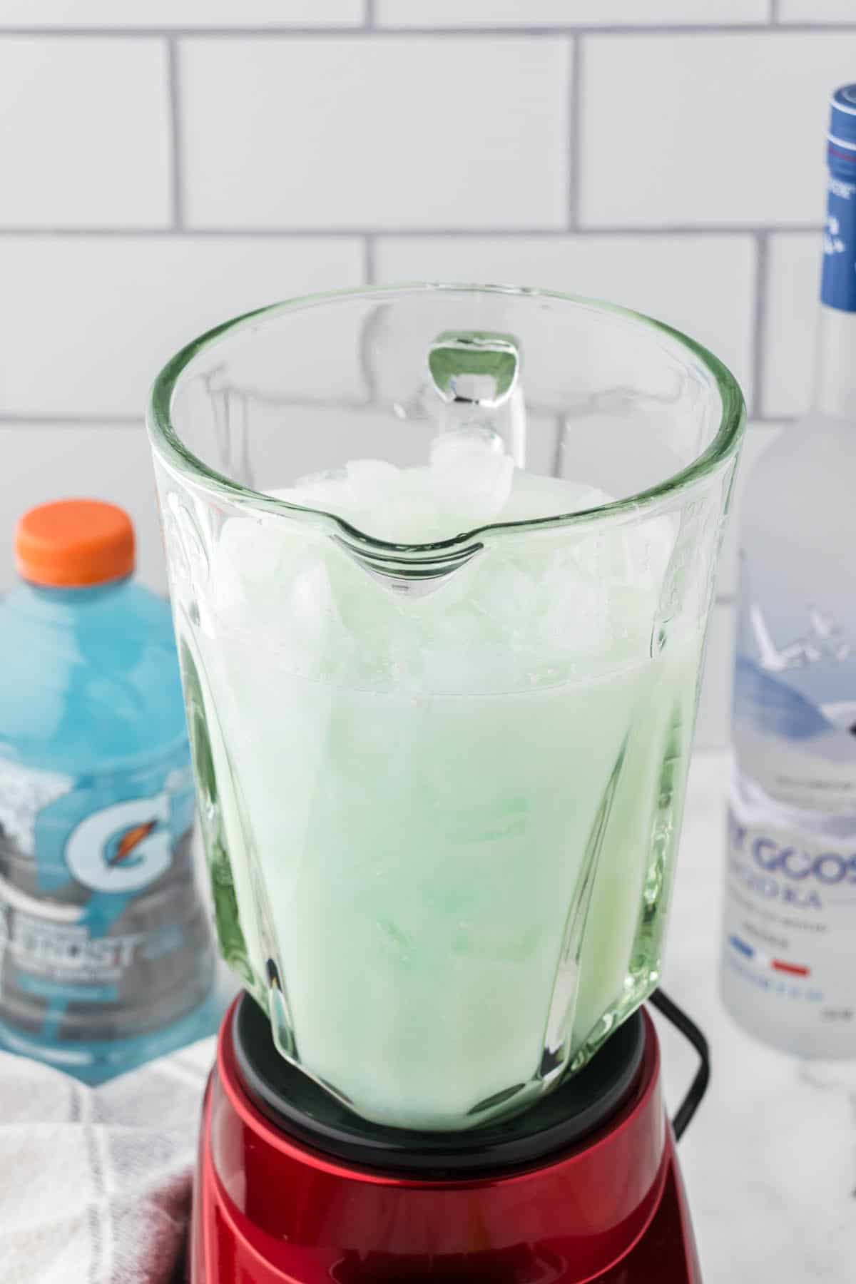 A batch of icy cocktails in a blender.