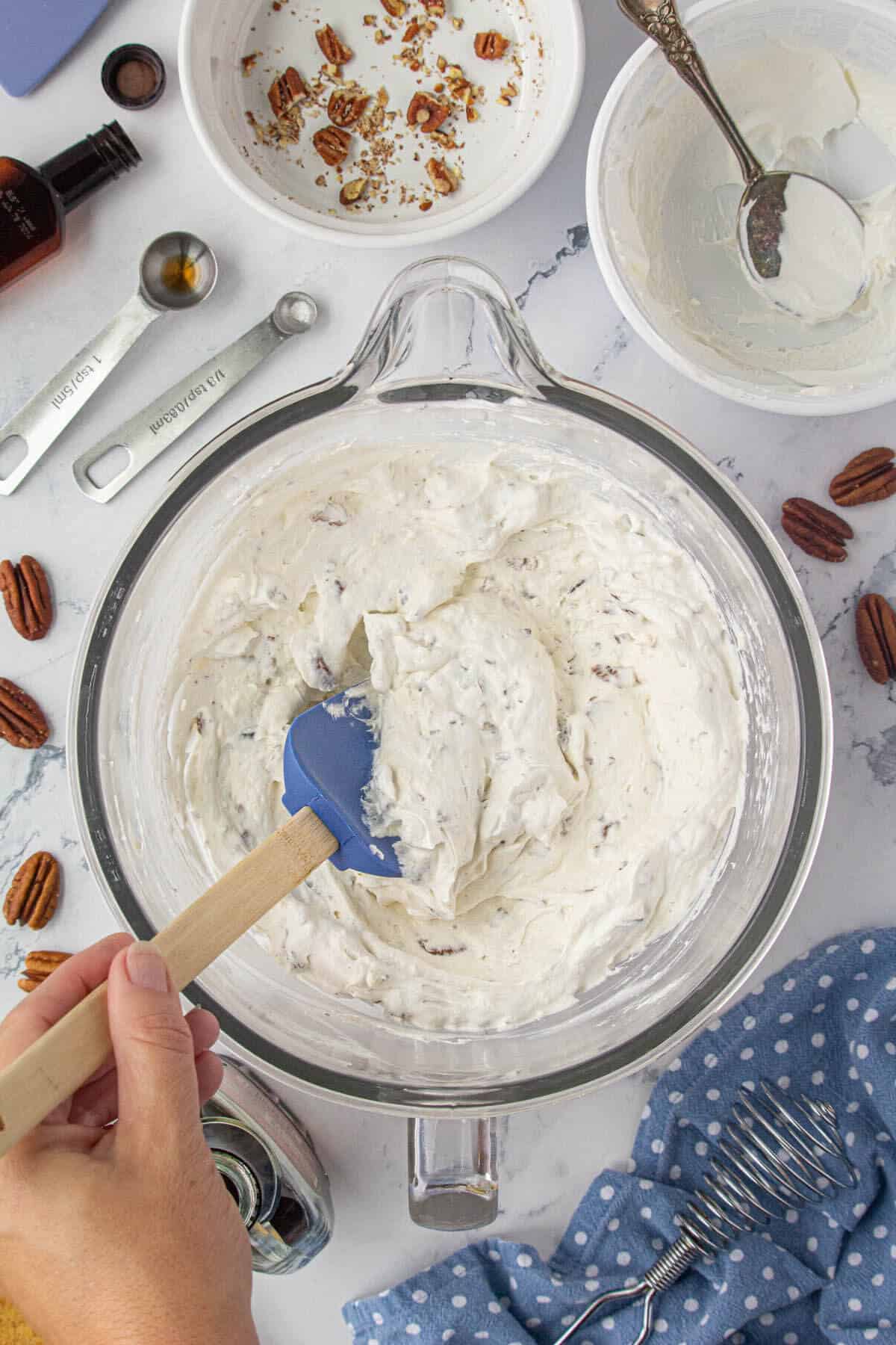 Pecan cream cheese pie mixture in a mixing bowl.