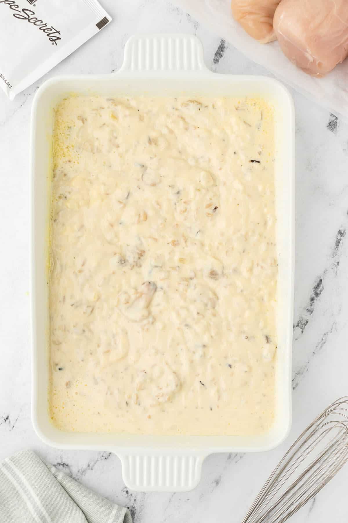 Cream soup and rice in a casserole dish.