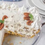 A slice of pecan cream pie on a serving spatula.