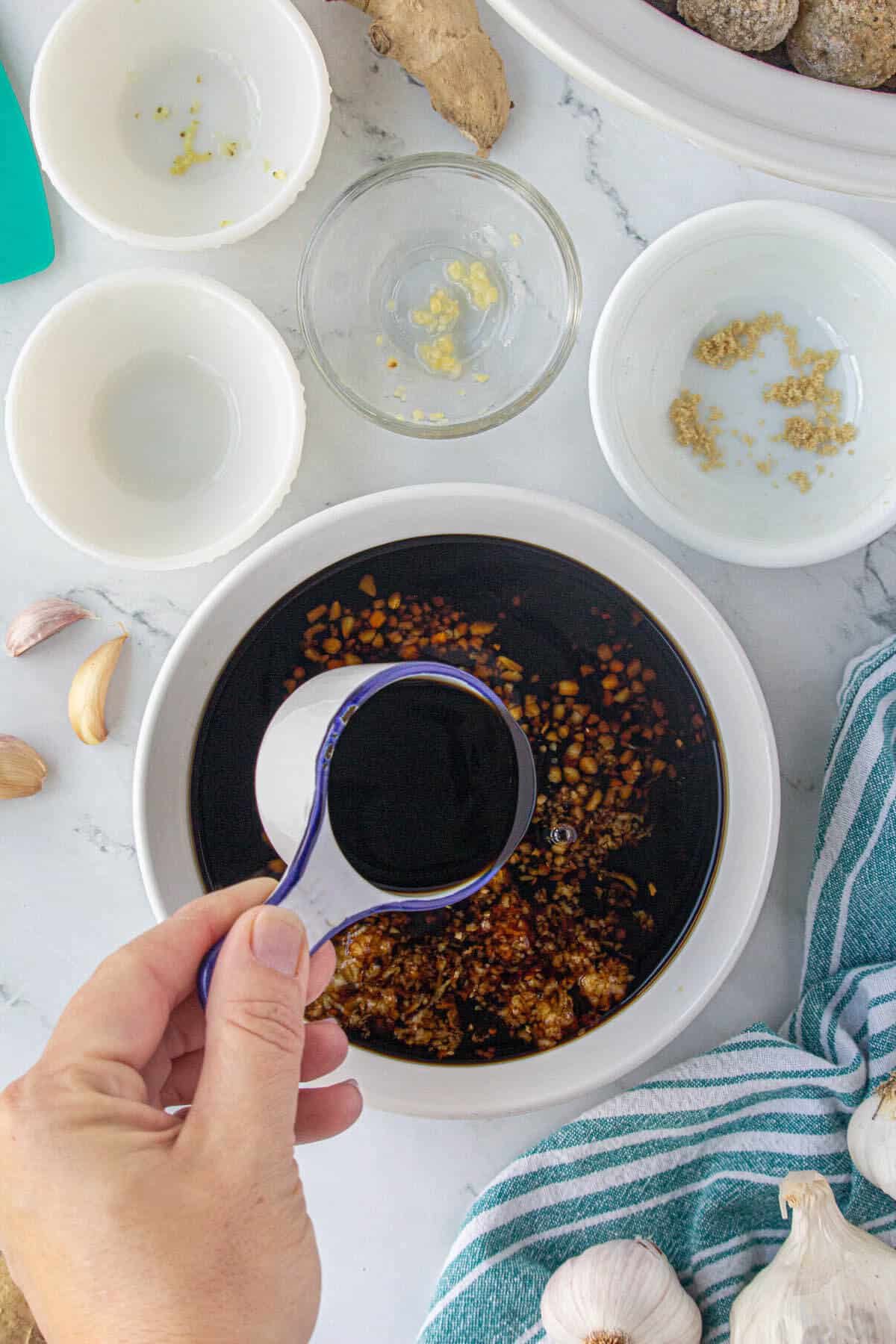 Step 1 is to combine the ingredients for the sauce in a small bowl.