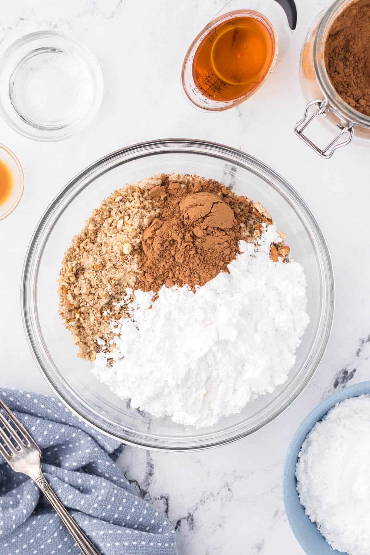 Powdered sugar, cocoa added to the pulverized cookie crumbs.