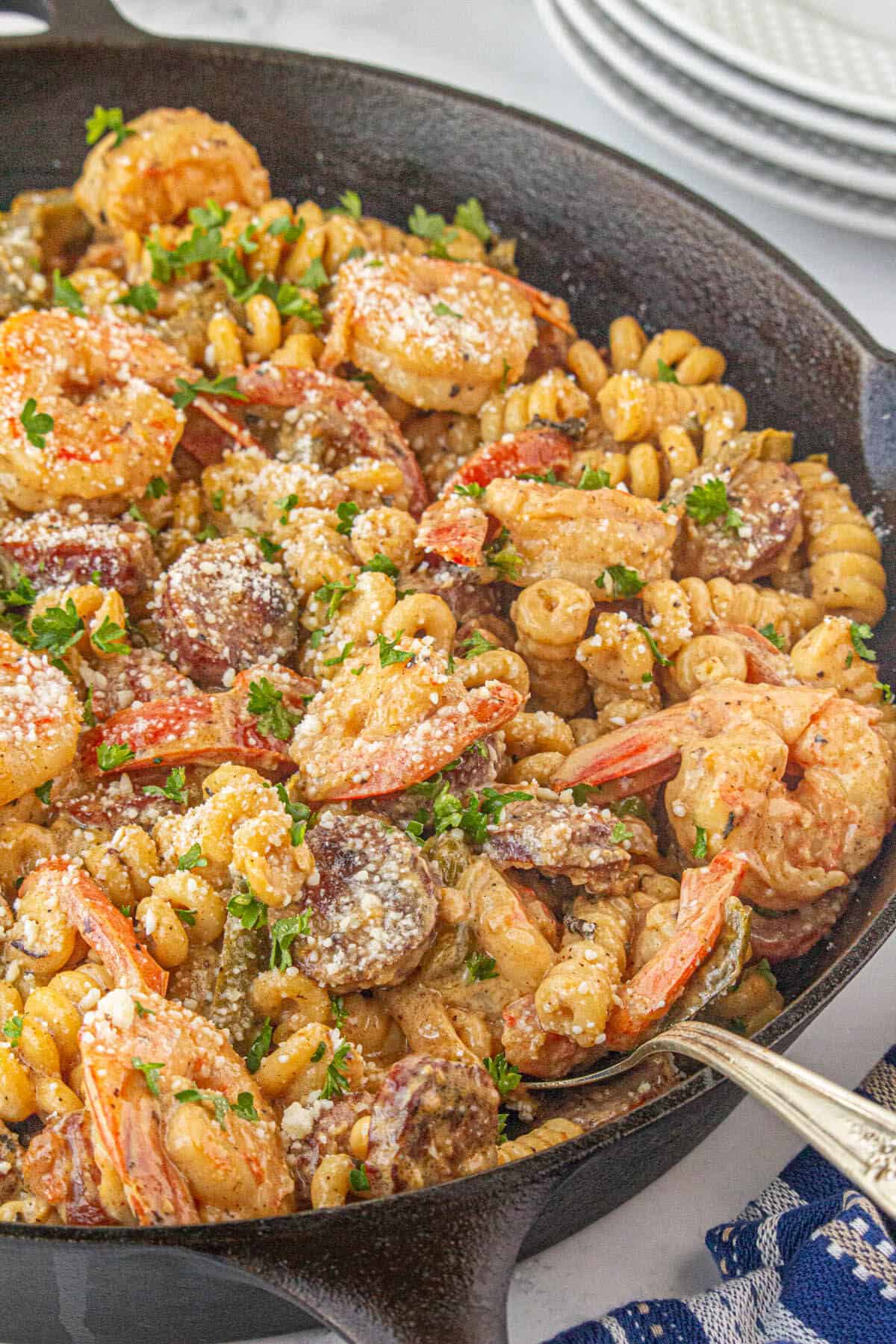 Cajun shrimp and andouille sausage pasta in a skillet.