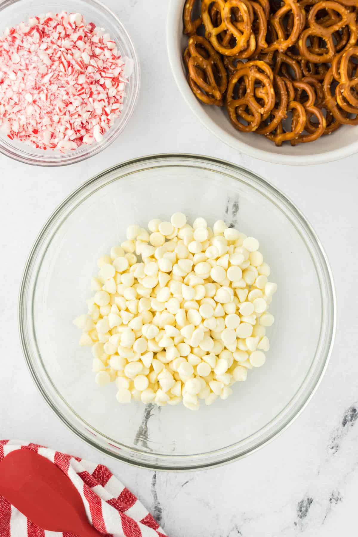 White chocolate chips in a bowl, ready to go into the microwave to melt.