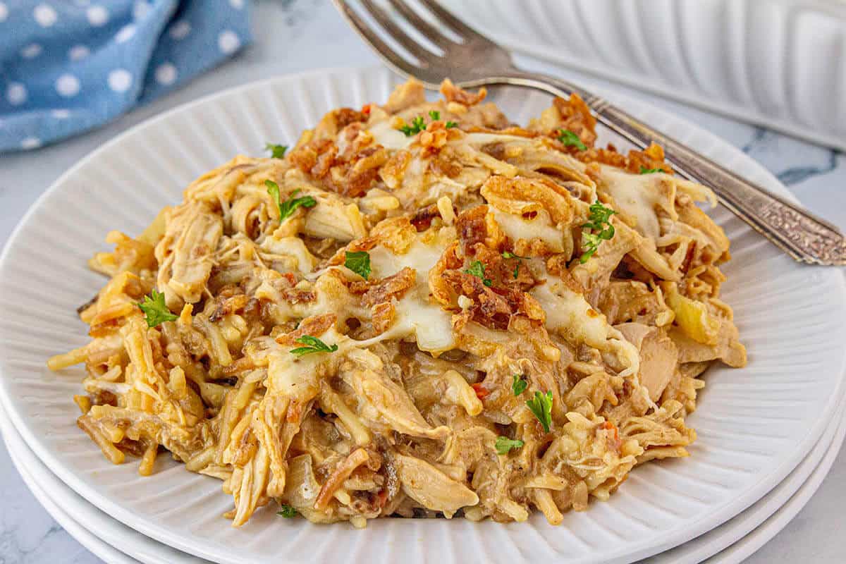 Baked French Onion Chicken and Rice on a palte with a fork.