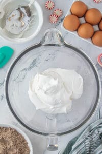 Cool whip and cream cheese in a mixing bowl.