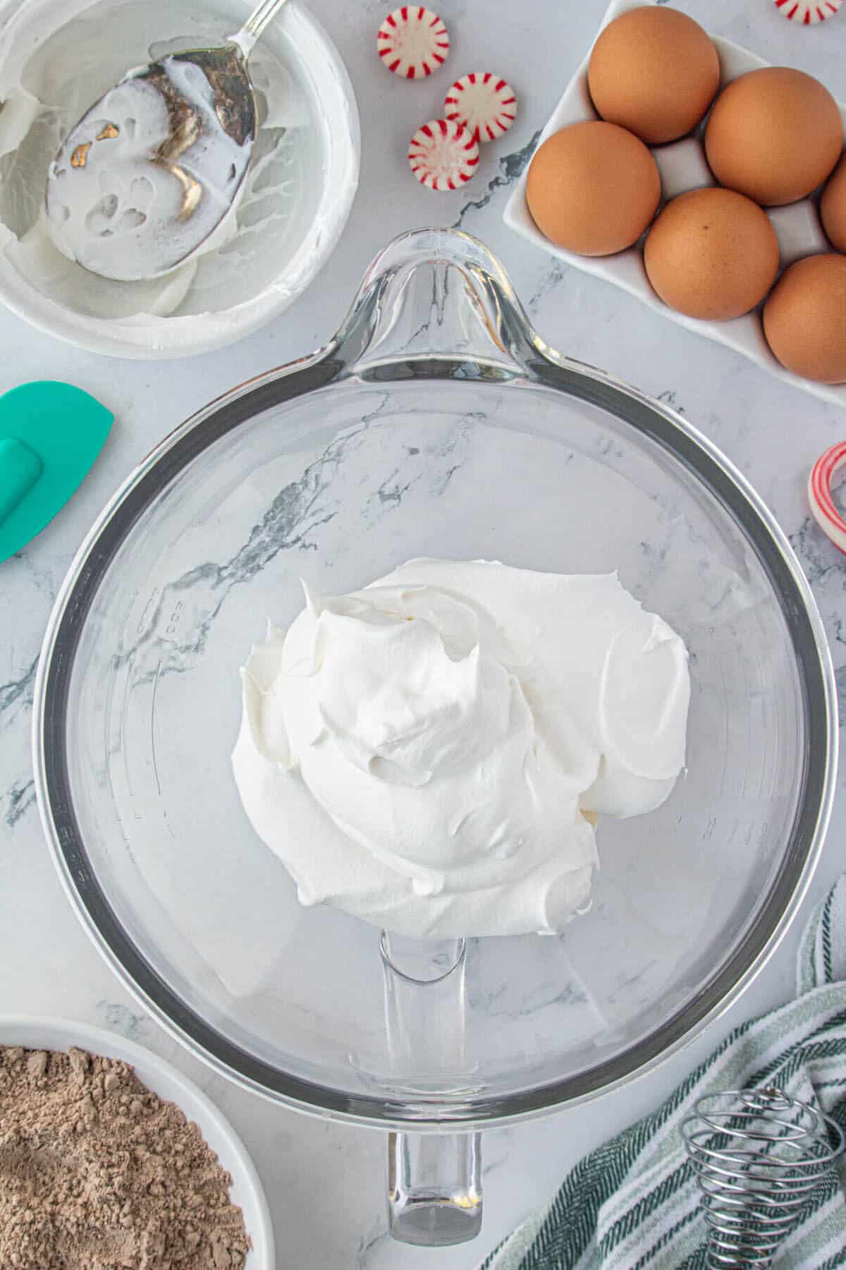 Cool whip and cream cheese in a mixing bowl.