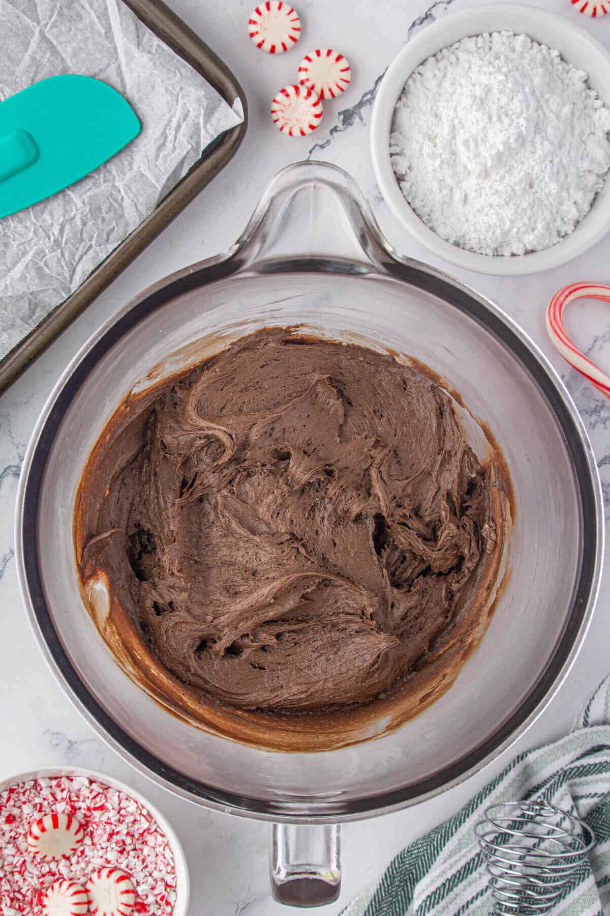 Rich, fudge cookie dough in a mixing bowl.