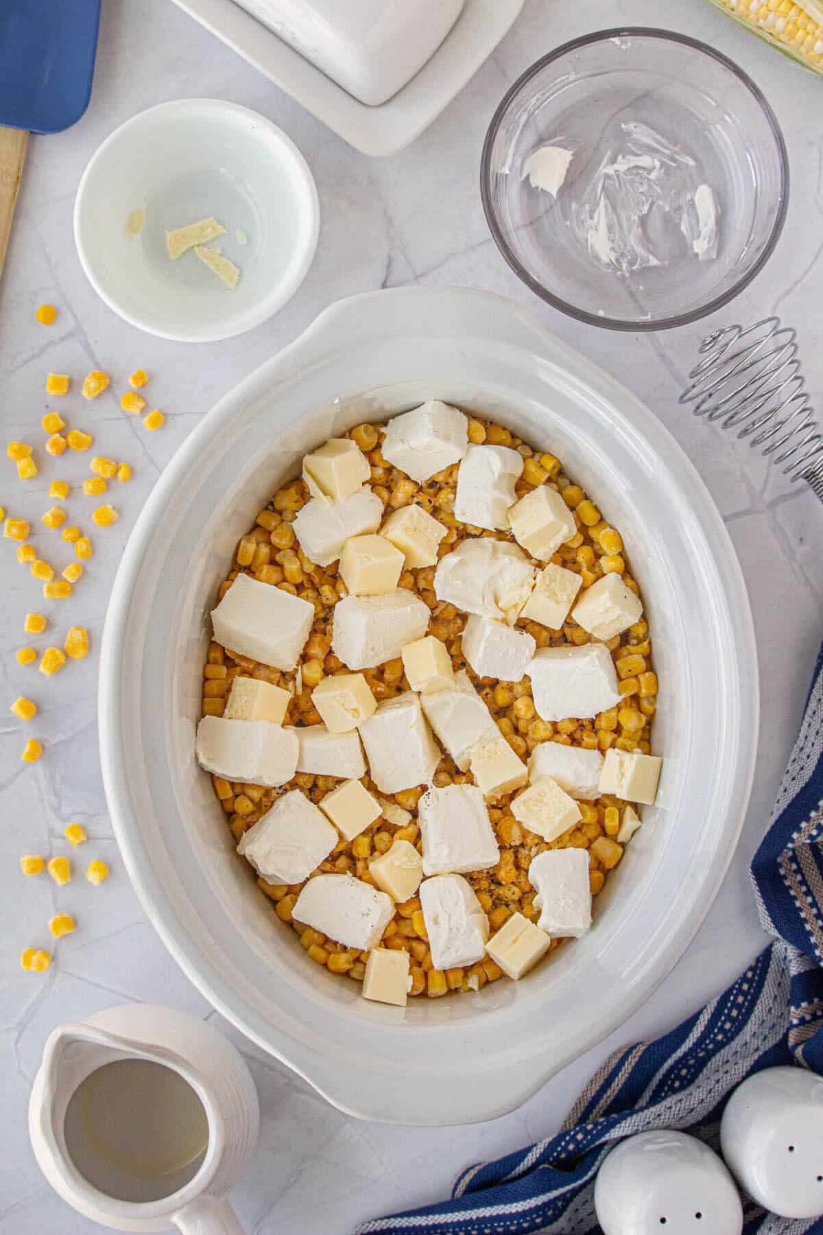 Butter and cream cheese added to the crockpot.