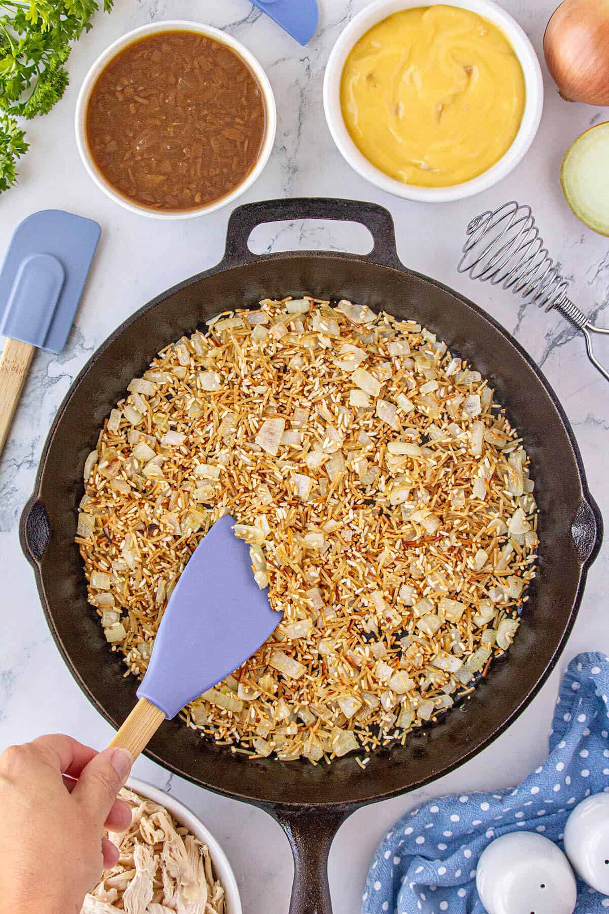 Rice a Roni sauteed in a skillet until golden brown.