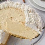 A slice of pie on a spatula, ready to serve.