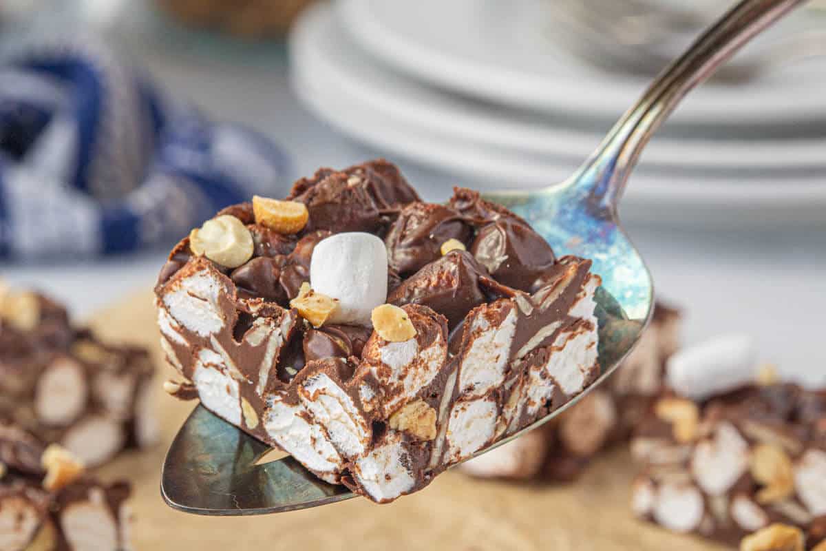 A slice of fudge being served on a spatula.