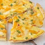 Sliced wedges of Tortilla Quiche on a platter.