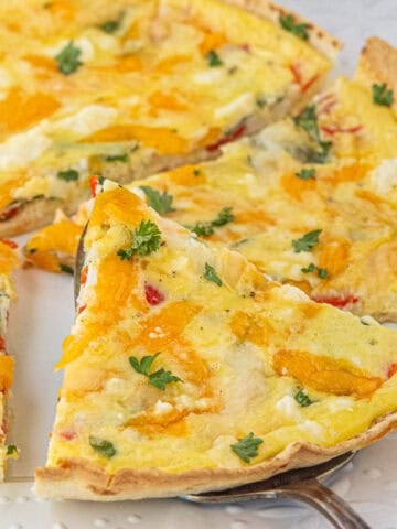 Sliced wedges of Tortilla Quiche on a platter.