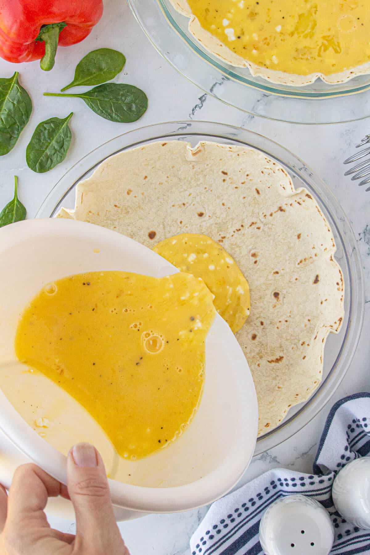 Egg mixture being pour into a tortilla crust.