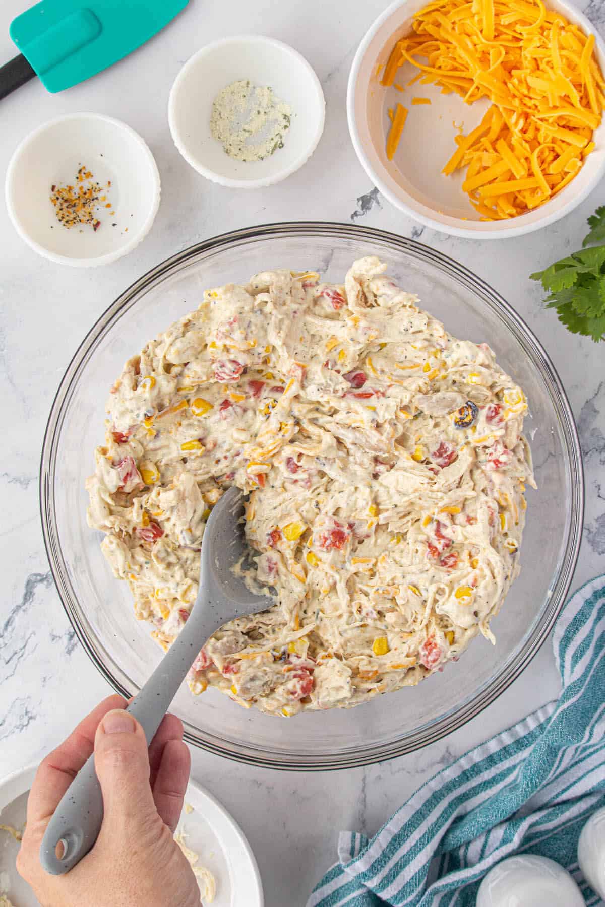 Creamy chicken casserole filling mixed in a large bowl.