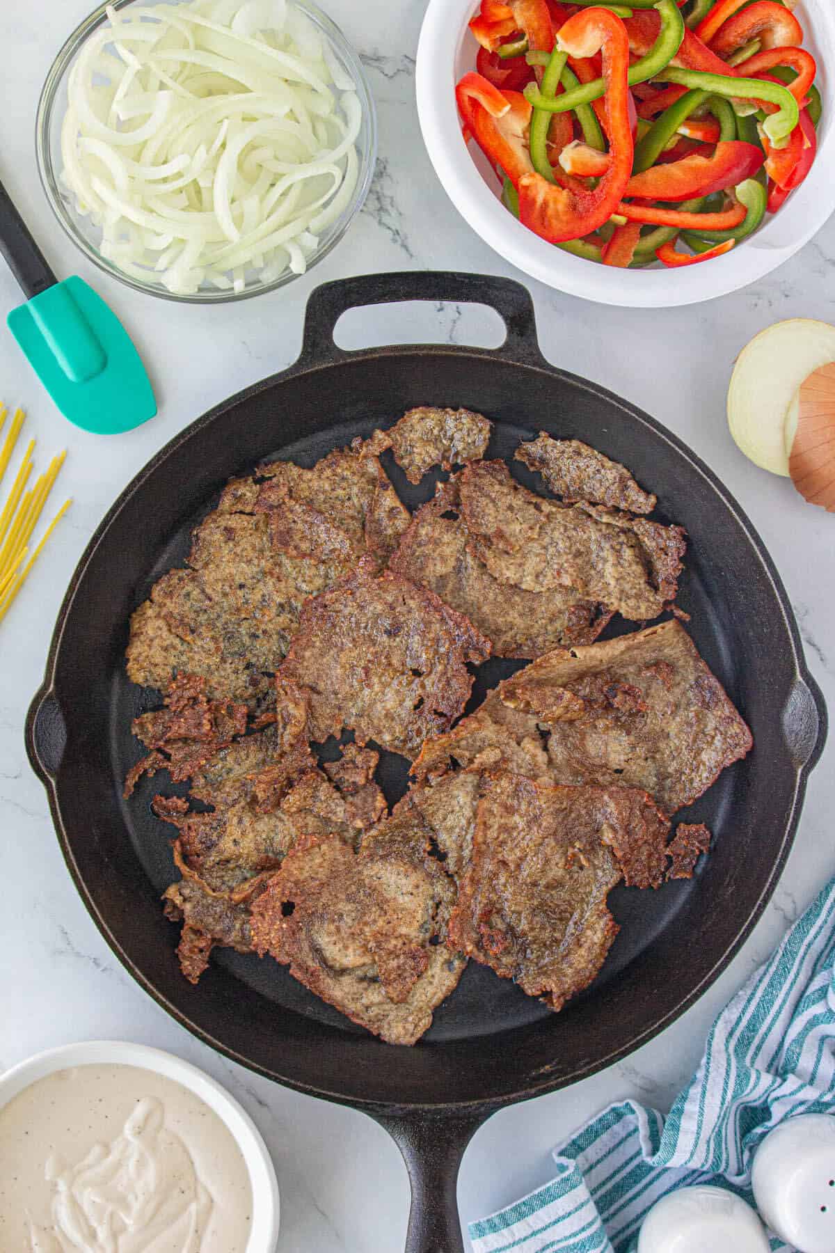 Browned Steak Umms in skillet.